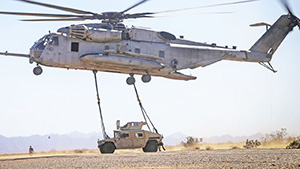 CH53 Super Stallion Helicopter Lifting a Humvee
