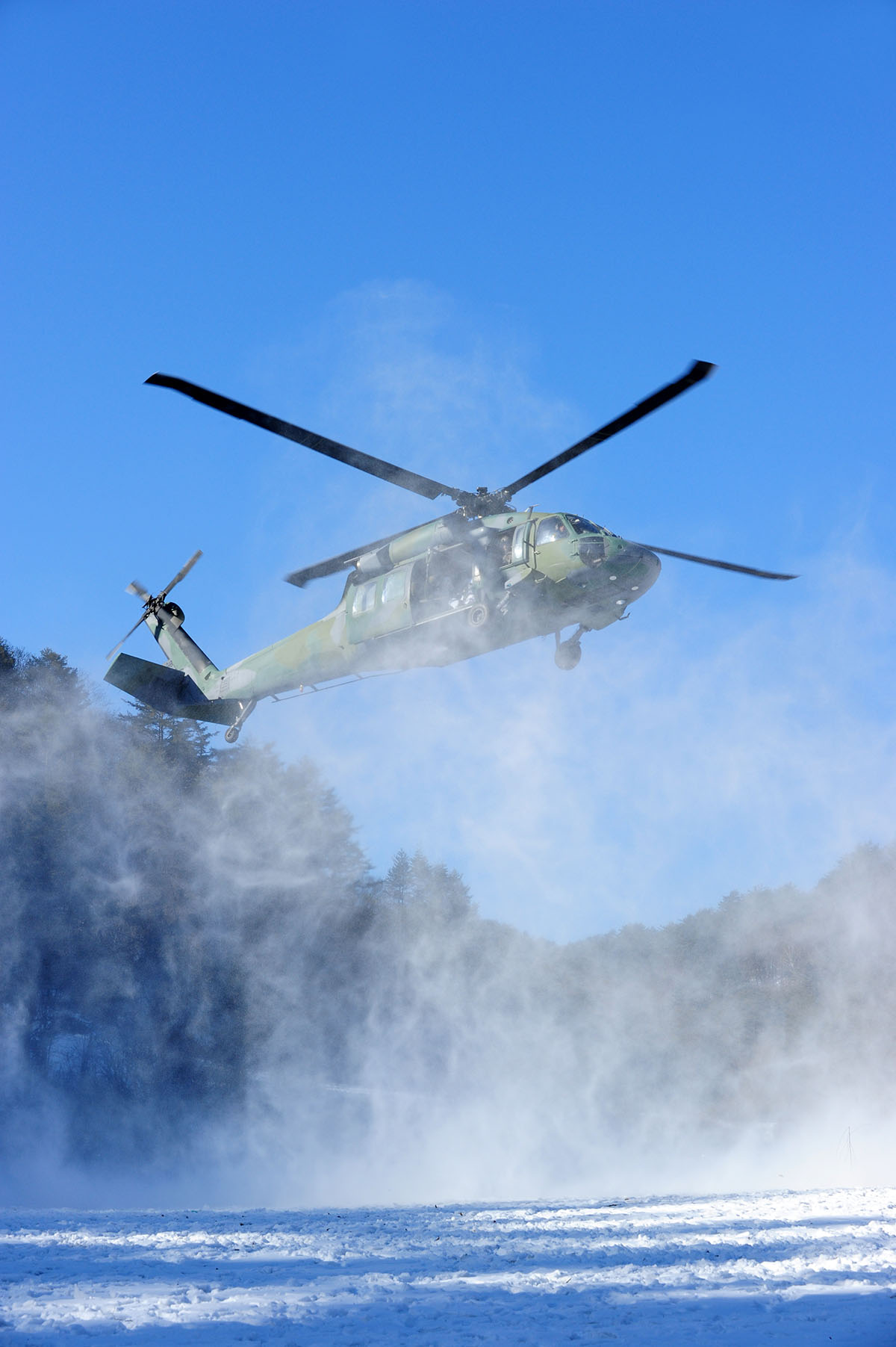 UH-60 Black Hawk Flying in Snow